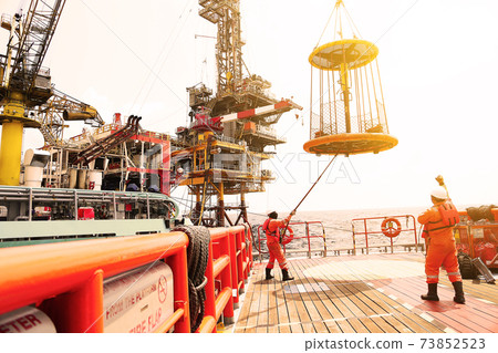 Crews boat moving the passenger and cargo from the platform to supply boat in oil and gas industry. Support offshore oil and gas industry by boat and service team. 73852523