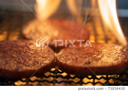 Arabiki sausage steak charcoal-grilled on a shichirin 73856430