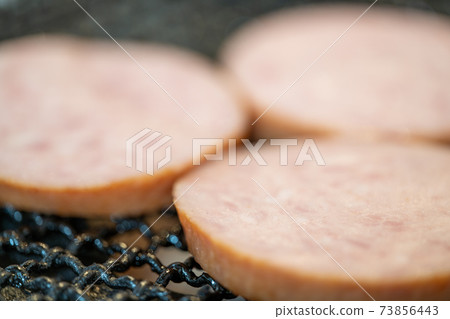 Arabiki sausage steak charcoal-grilled on a shichirin 73856443