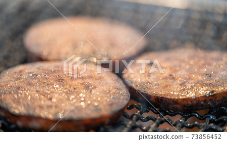 Arabiki sausage steak charcoal-grilled on a shichirin 73856452