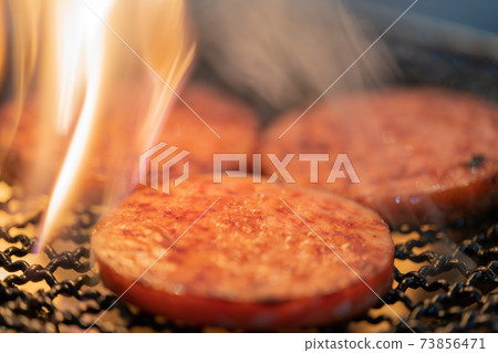Arabiki sausage steak charcoal-grilled on a shichirin 73856471