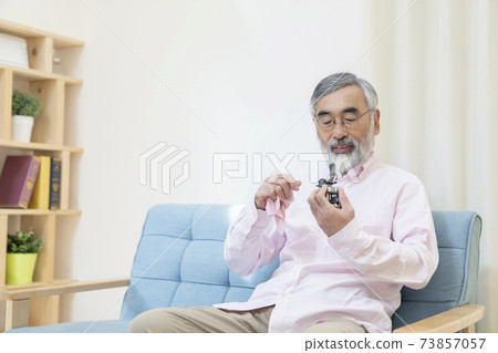 Senior man enjoying his hobbies 73857057