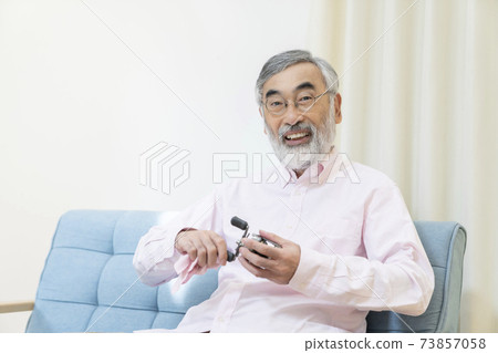 Senior man enjoying his hobbies 73857058