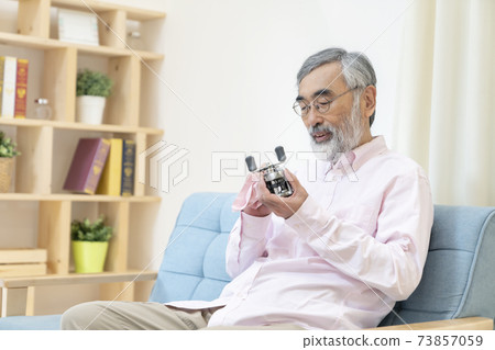 Senior man enjoying his hobbies 73857059