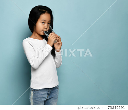 Asian Korean kid girl in jeans and white long Asian Korean kid girl in jeans and white long 73859291