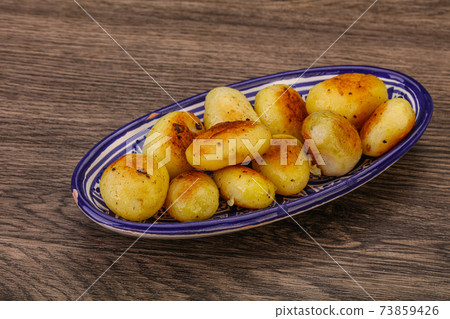 Roasted baby potato in the bowl 73859426