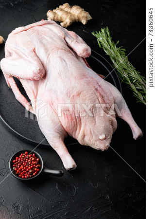 Raw wild mallard ducks meat on black background Raw wild mallard ducks meat on black background 73860645