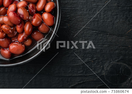 Azuki beans, on black wooden table background, top view flat lay with copy space for text 73860674