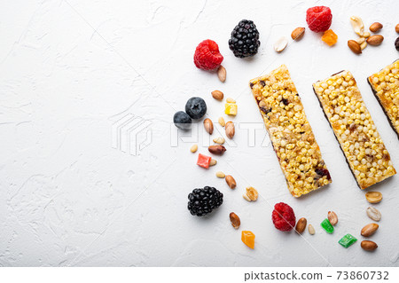 Energy bars snack, flat lay with space for text, on white background Energy bars snack, flat lay with space for text, on white background 73860732