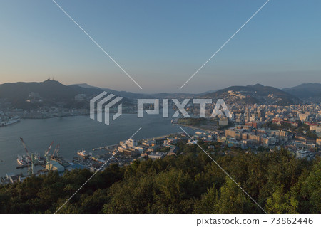 Evening view of Nagasaki city from Nabekanzan Park observatory Evening view of Nagasaki city from Nabekanzan Park observatory 73862446