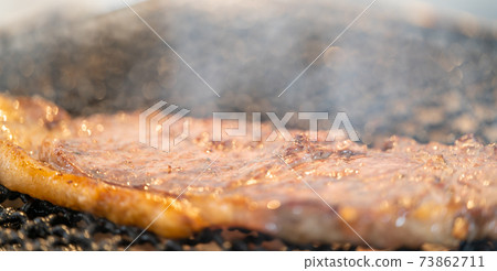 Domestic beef sirloin steak charcoal-grilled on a shichirin Domestic beef sirloin steak charcoal-grilled on a shichirin 73862711