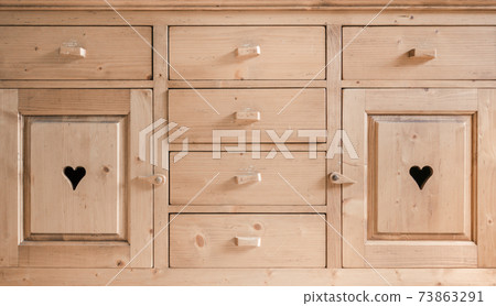 Rustic cupboard door with an engraved heart Rustic cupboard door with an engraved heart 73863291