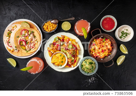 Mexican food, a flat lay overhead shot on a black background Mexican food, a flat lay overhead shot on a black background 73863506