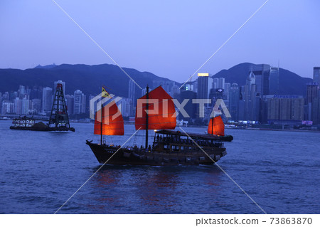 Bay sightseeing boat "Aqualna" sailing in the dimly lit Victoria Bay Bay sightseeing boat "Aqualna" sailing in the dimly lit Victoria Bay 73863870