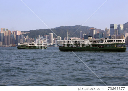 Star ferry sailing through Victoria Bay in Hong Kong 73863877