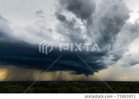 Storm clouds with the rain. Nature Environment Dark huge cloud sky black stormy cloud . Storm clouds with the rain. Nature Environment Dark huge cloud sky black stormy cloud . 73863951