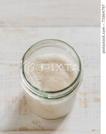 Wheat sourdough starter, top view, copy space Wheat sourdough starter, top view, copy space 73864797