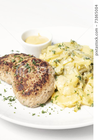 german frikadellen meatballs with creamy onion fried potatoes 73865084