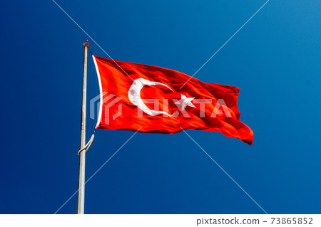 Turkish national flag with white star and moon in sky Turkish national flag with white star and moon in sky 73865852