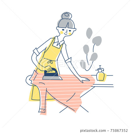 Woman in an apron ironing Woman in an apron ironing 73867352