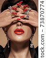 Fashion portrait in warm colors. Studio shooting. 73870774