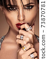 Fashion portrait in warm colors. Studio shooting. 73870781