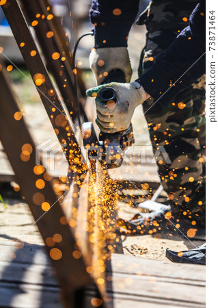 Sparks from cutting metal on the rack 73871464