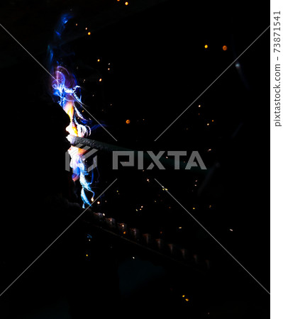 Flame of fire and sparks from welding metal at night Flame of fire and sparks from welding metal at night 73871541