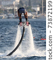 A man on a water attraction at sea 73872199