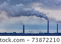 Smoke from the chimneys at the factory 73872210