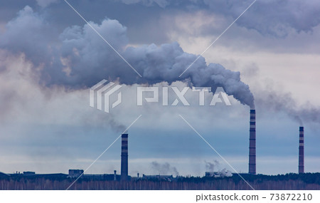 Smoke from the chimneys at the factory 73872210