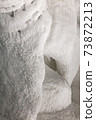 White walls of ice and snow in a cave 73872213
