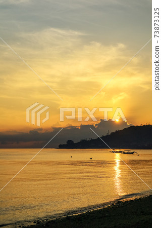 Views of the beach and the ocean at sunrise. Views of the beach and the ocean at sunrise. 73873125