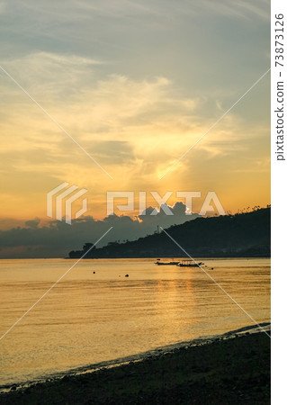 Views of the beach and the ocean at sunrise. Views of the beach and the ocean at sunrise. 73873126
