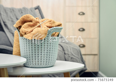 Basket with knitting project in progress 73873149
