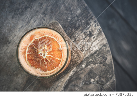 Orange Cocktail with orange, carrot and papaya juice Orange Cocktail with orange, carrot and papaya juice 73873333