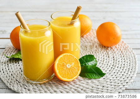 Two Glasses of Fresh Orange Juice 73873586