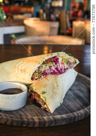 Falafel dosa with sauce. Falafel dosa with sauce. 73873786