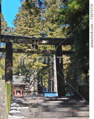 Stone torii gate at the entrance of Nikko Toshogu 73874770