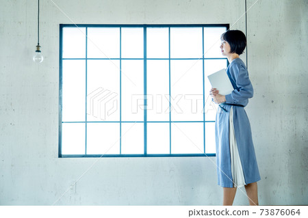 A woman using a computer A woman using a computer 73876064
