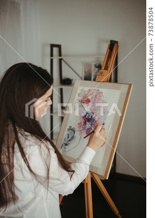 Young woman do easel drawing, creative hobby Young woman do easel drawing, creative hobby 73878504
