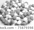 Monochrome large number of capsules (medicines, supplements) stock photos 73879398