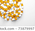 Photo material of a large number of capsules (medicines, supplements) with copy space 73879997