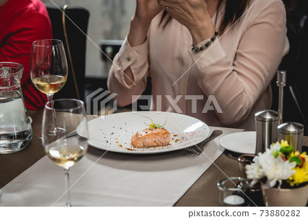 delicious salmon in a restaurant. small portion 73880282