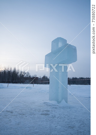 An Orthodox cross made of ice. The feast of the Epiphany 73880722