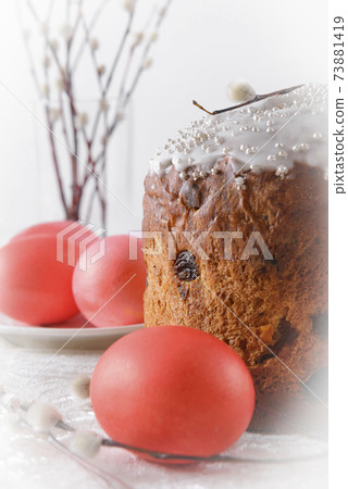 easter cake with willow twigs pink eggs on a light 73881419