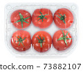 Transparent plastic container with fresh tomatoes isolated on a white background with a clipping 73882107