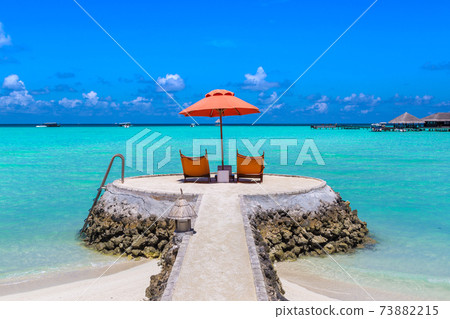 Sunbed and umbrella in the Maldives 73882215