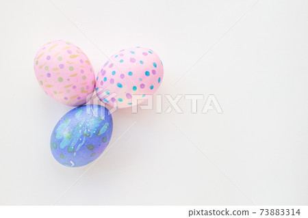 Set of colorful hand-painted Easter eggs. Bright children's drawings on Easter eggs top view on a white background. Happy Easter holiday and fun for children Set of colorful hand-painted Easter eggs. Bright children's drawings on Easter eggs top view on a white background. Happy Easter holiday and fun for children 73883314