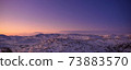sunrise in the snowy mountains 73883570